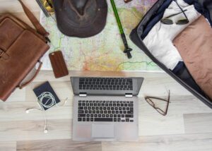 laptop,travel,with,stylish,glasses,,passport,,leather,bag,,map,of