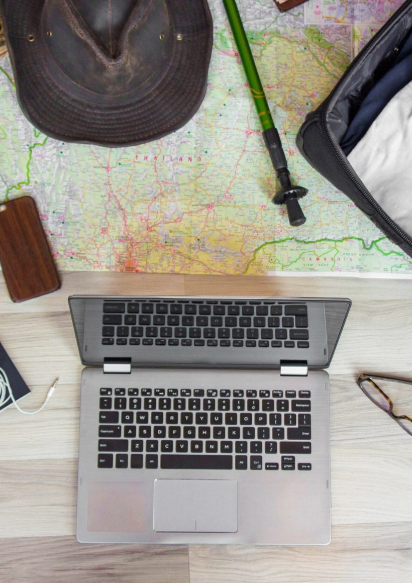 laptop,travel,with,stylish,glasses,,passport,,leather,bag,,map,of